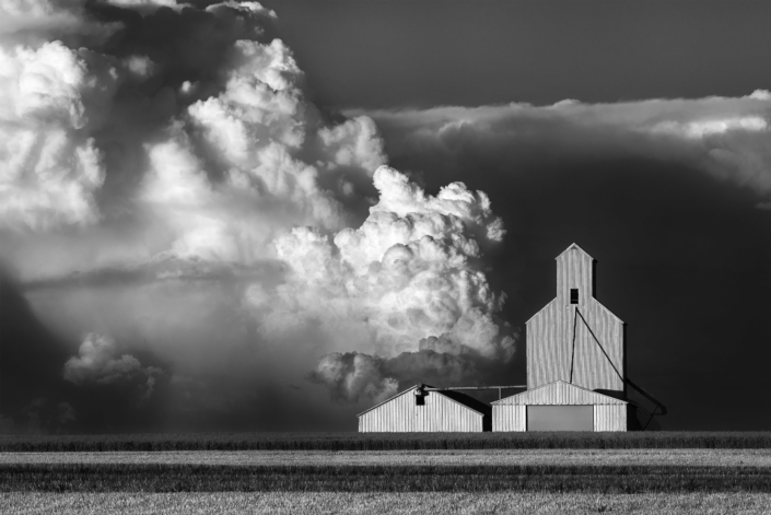 Commercial Advertising Photography, Storm clouds approaching grain elevator in Montana.